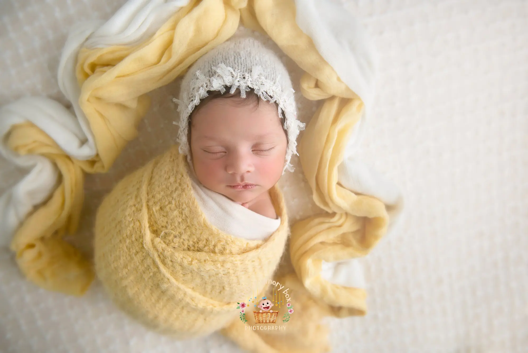 Cute baby with Yellow wrap.